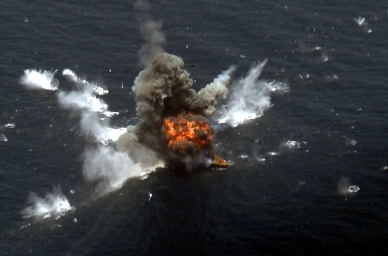 An explosion is seen after a new Iranian locally made cruise missile was fired during war games in the northern Indian Ocean and near the entrance to the Gulf, Iran. West Asia News Agency via REUTERS